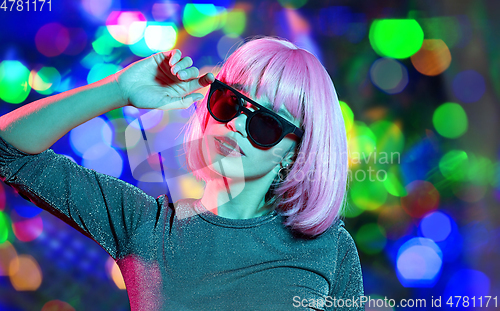 Image of happy woman in pink wig and black sunglasses