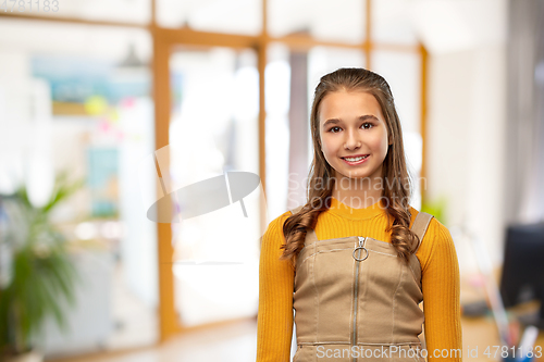Image of smiling teenage student girl at school
