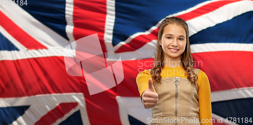 Image of teenage girl showing thumbs up over british flag