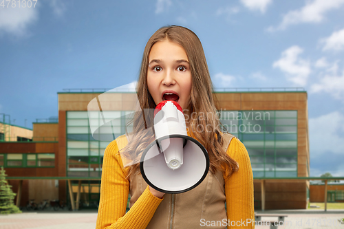 Image of teenage girl speaking to megaphone over school