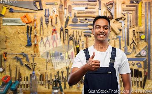 Image of happy indian worker or builder showing thumbs up