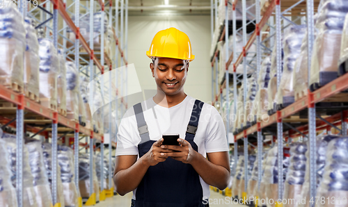 Image of loader or worker with smartphone at warehouse