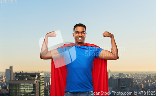 Image of indian man in superhero cape showing his power