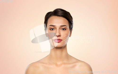 Image of beautiful young woman with bare shoulder