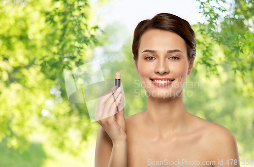 Image of beautiful smiling young woman with pink lipstick