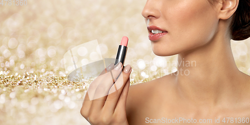 Image of beautiful smiling young woman with pink lipstick