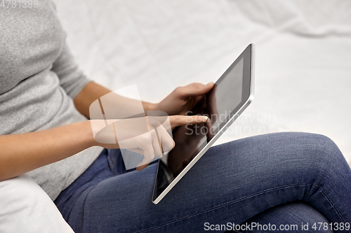 Image of close up of young woman with tablet computer