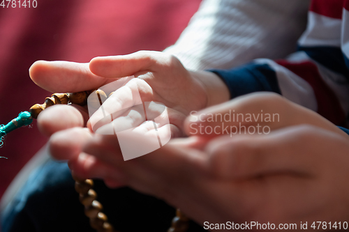 Image of muslim prayer father and son in mosque prayingtogether