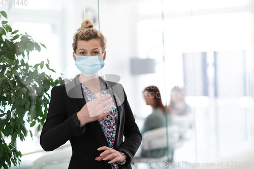 Image of business woman portrait in medical protective mask