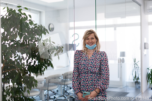 Image of business woman portrait in medical protective mask