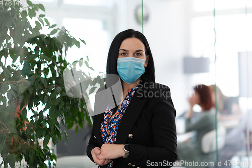 Image of business woman portrait in medical protective mask