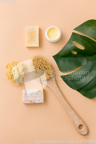 Image of natural soap, brush, sponge and body butter