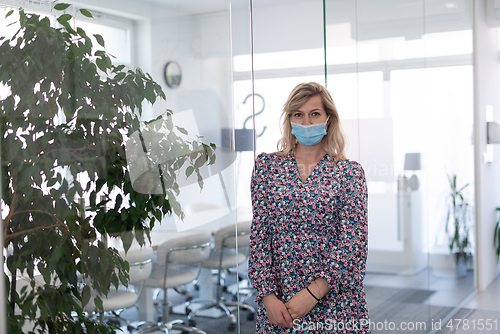 Image of business woman portrait in medical protective mask