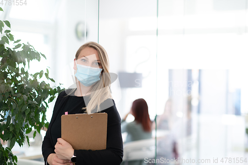 Image of business woman portrait in medical protective mask