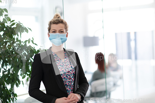 Image of business woman portrait in medical protective mask