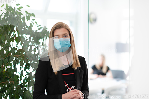 Image of business woman portrait in medical protective mask