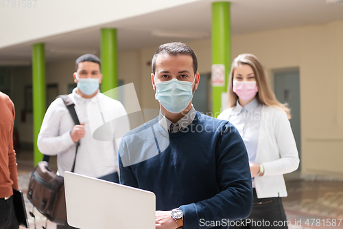 Image of Multiethnic students group wearing protective face mask