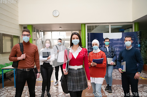 Image of students group at university walking and wearing face mask