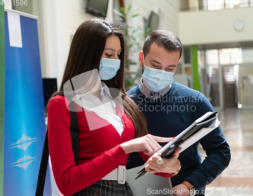 Image of Portrait of multiethnic students group at university wearing protective face mask