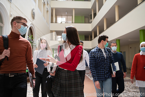 Image of students group at university walking and wearing face mask