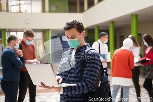 Image of Portrait of multiethnic students group at university wearing protective face mask