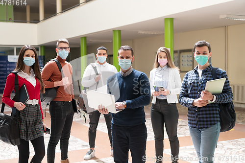 Image of Multiethnic students group wearing protective face mask