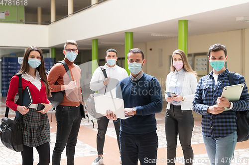 Image of Multiethnic students group wearing protective face mask