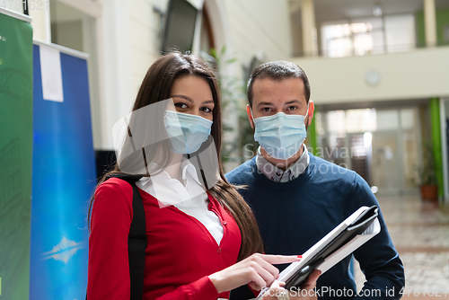 Image of Portrait of multiethnic students group at university wearing protective face mask