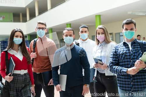 Image of Multiethnic students group wearing protective face mask
