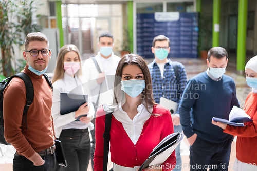 Image of students group at university walking and wearing face mask