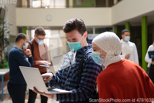 Image of Portrait of multiethnic students group at university wearing protective face mask