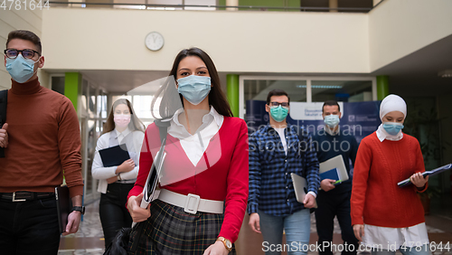 Image of students group at university walking and wearing face mask