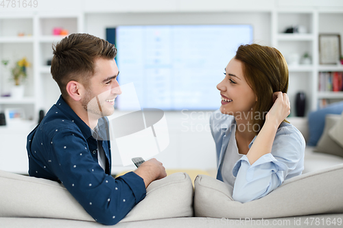 Image of a young married couple enjoys sitting in the large living room