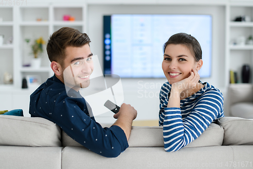 Image of a young married couple enjoys sitting in the large living room