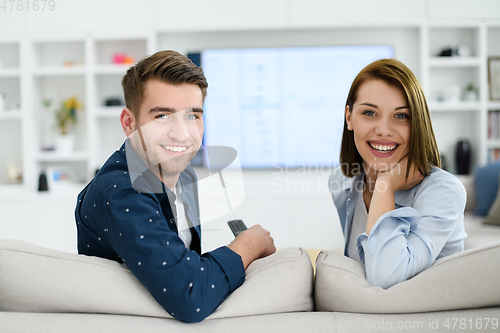 Image of a young married couple enjoys sitting in the large living room
