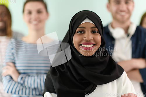 Image of group of diverse teenagers posing in a studio, determined teenagers in diverse clothing.