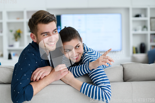 Image of a young married couple enjoys sitting in the large living room