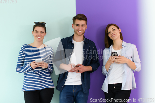 Image of a group of teenagers use mobile devices