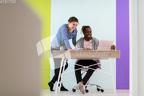 Image of merican and a young girl plan meetings together and use a laptop for an online meeting