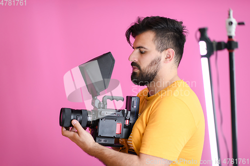 Image of cameraman with professional equipment shoots video clips