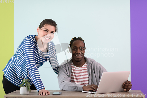 Image of merican and a young girl plan meetings together and use a laptop for an online meeting