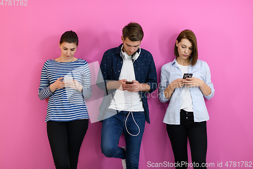 Image of group of friends have fun and dance while using a cell phone and headphones