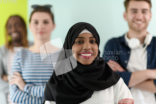 Image of group of diverse teenagers posing in a studio, determined teenagers in diverse clothing.