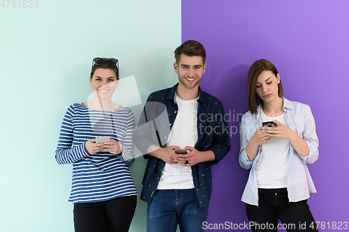 Image of a group of teenagers use mobile devices