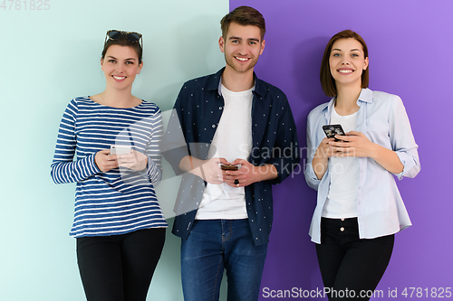 Image of a group of teenagers use mobile devices