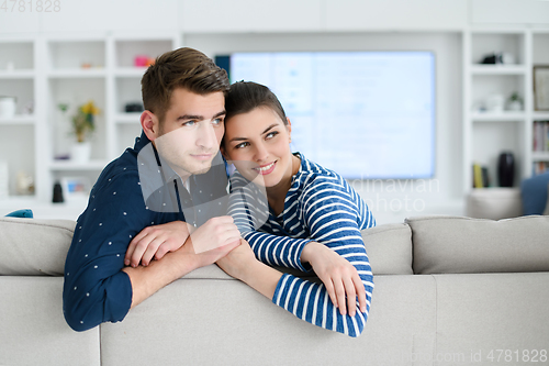 Image of a young married couple enjoys sitting in the large living room