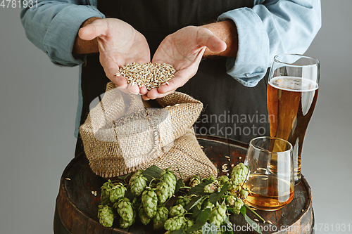 Image of Close up of confident senior man brewer with self crafted beer