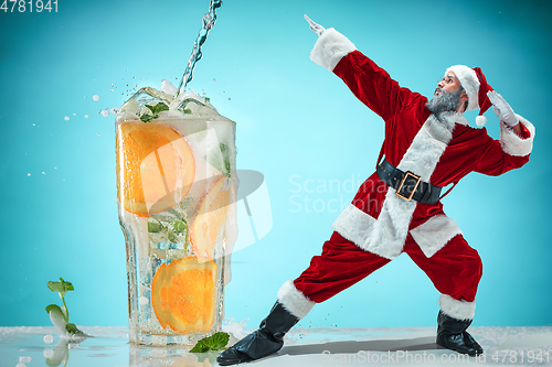 Image of Happy Christmas Santa Claus on studio background