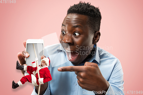 Image of Happy Christmas Santa Claus on studio background