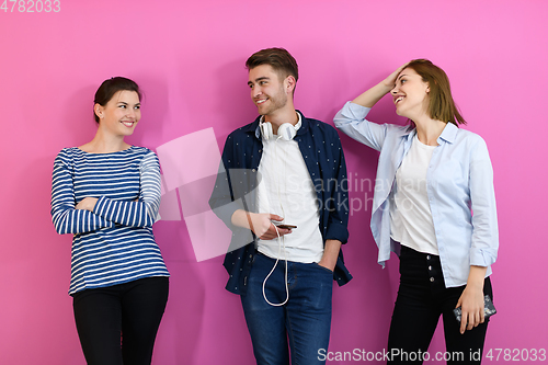 Image of group of friends have fun and dance while using a cell phone and headphones